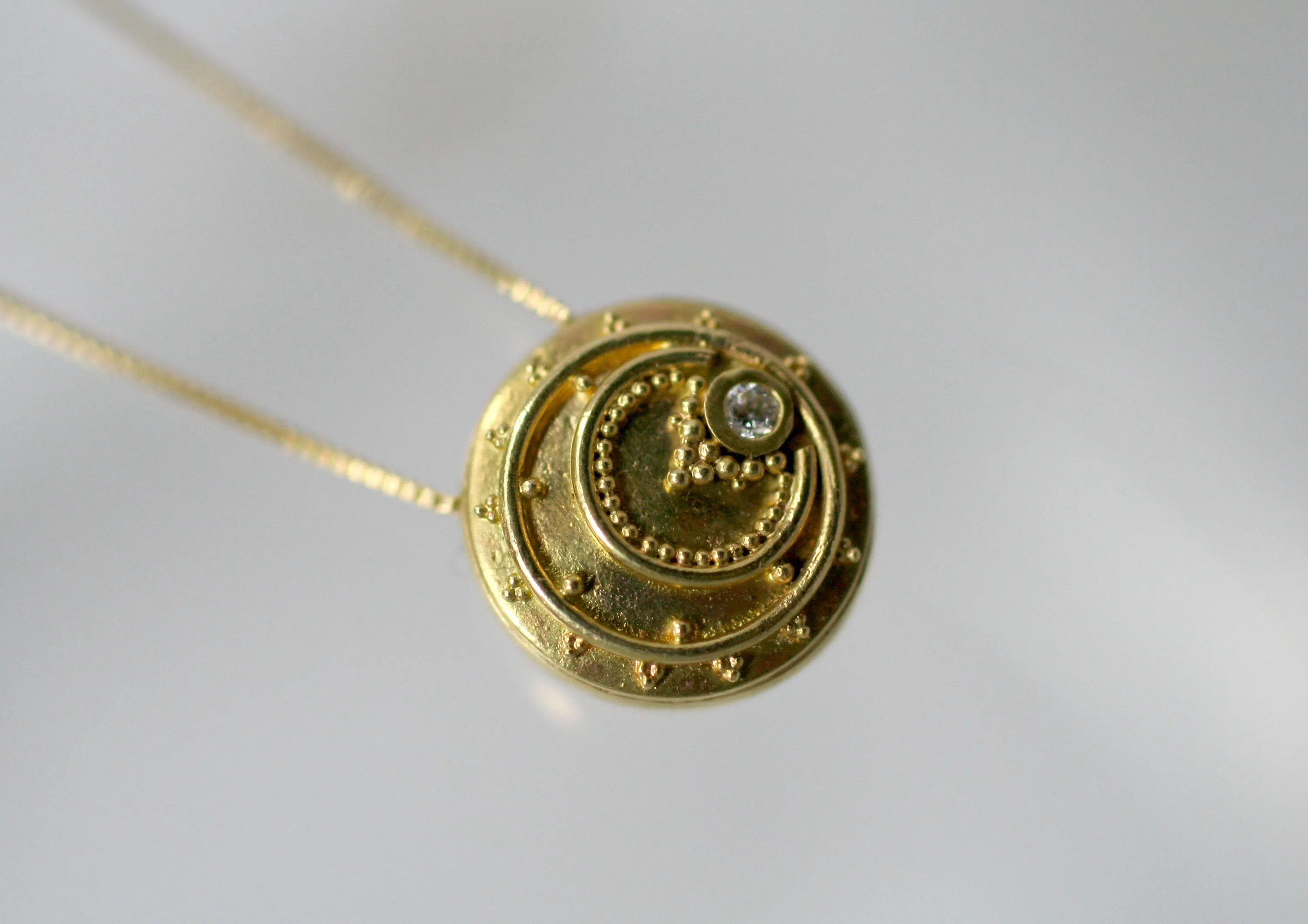 18kt Eclipse Token Pendants
