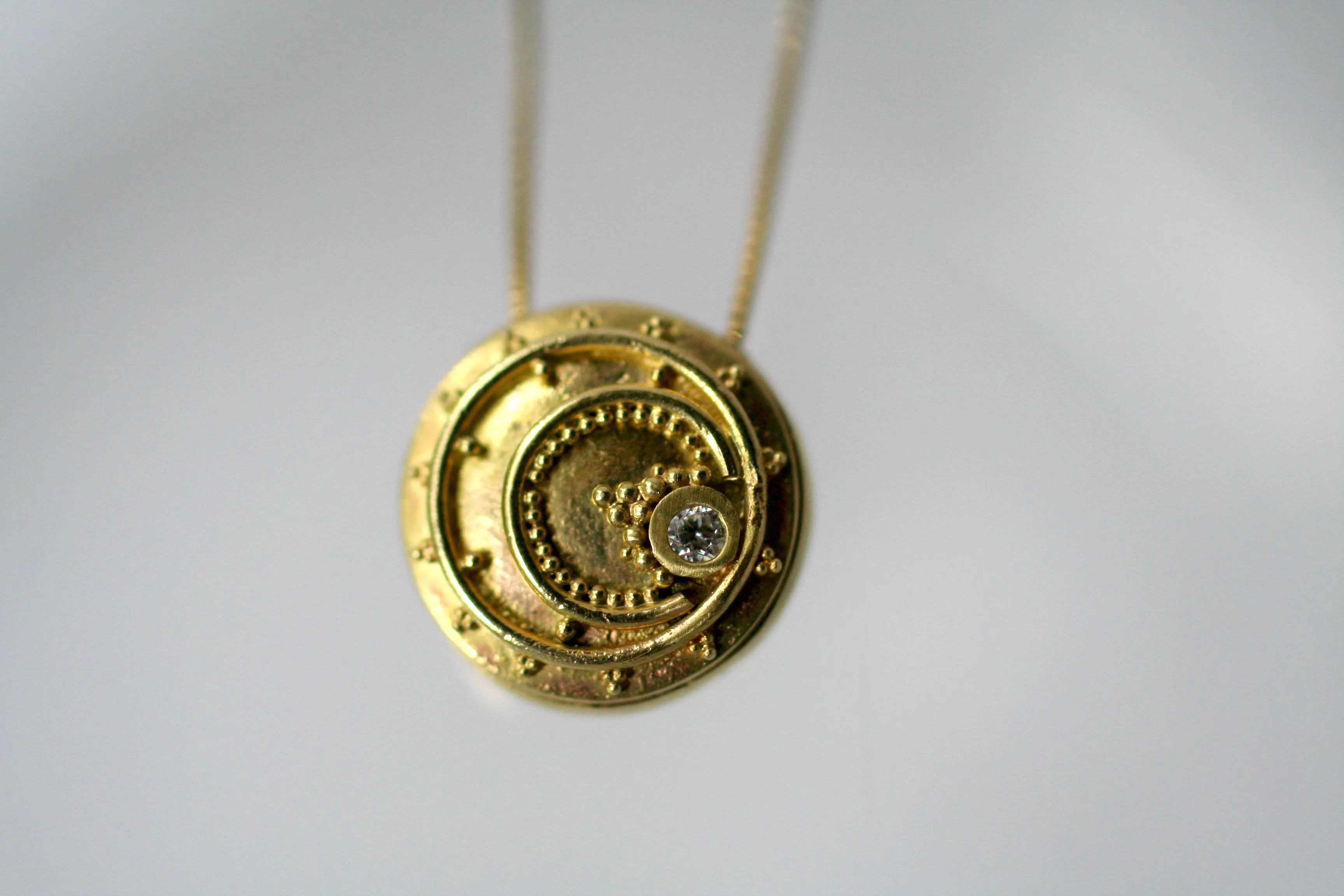 18kt Eclipse Token Pendants