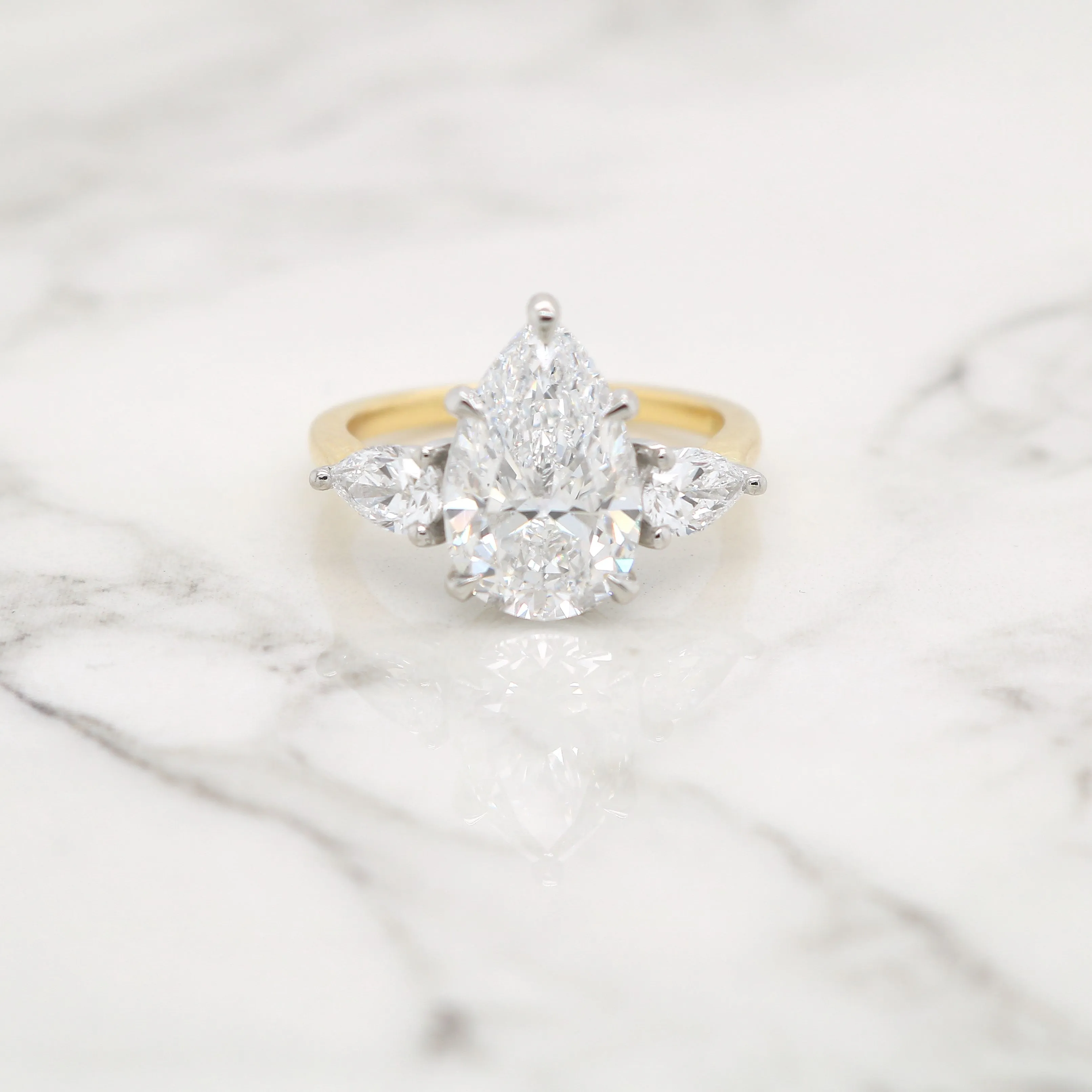 3 Stone Pear with Two Tone Setting