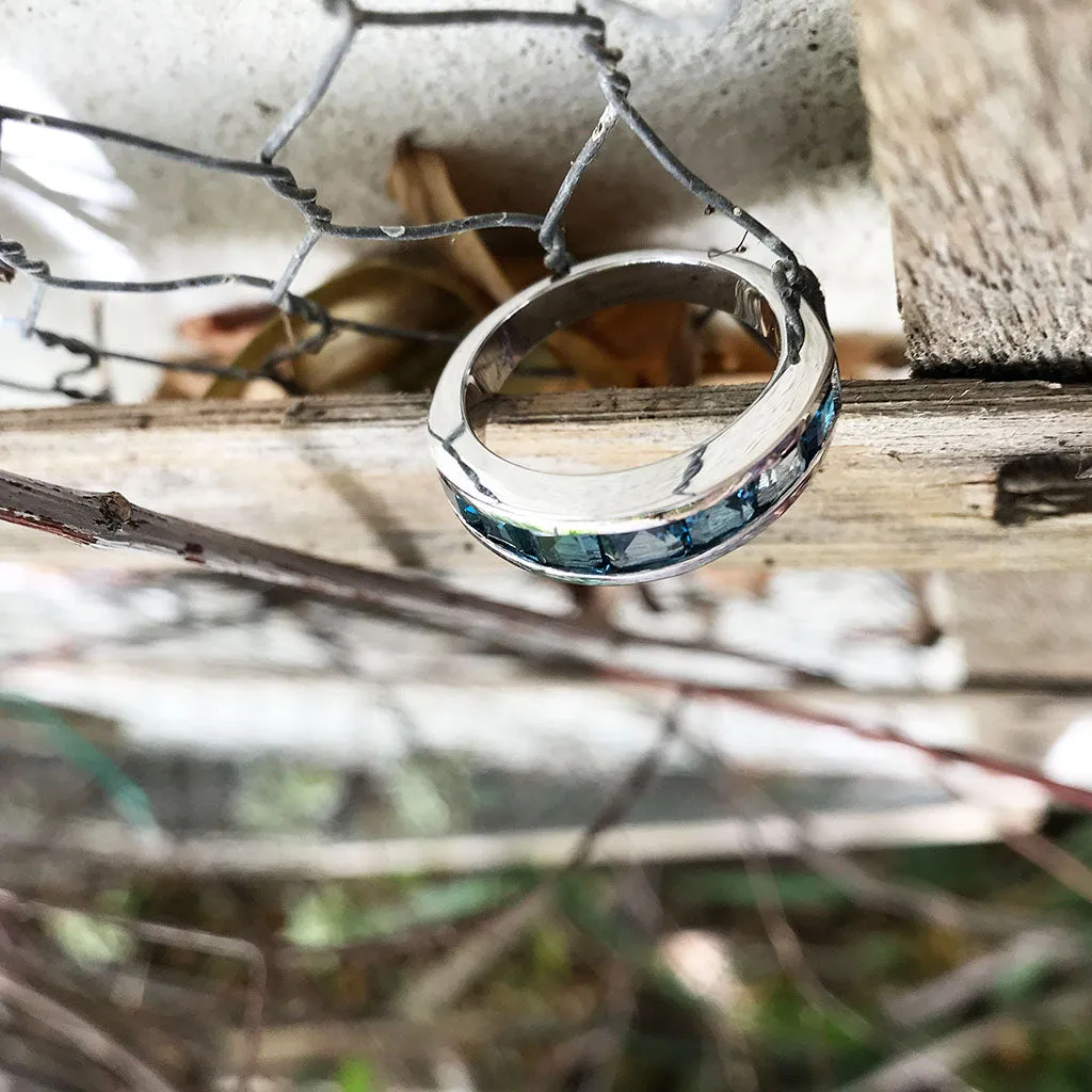 Contemporary Half Eternity Ring Featuring Seven Square Cut London Blue Topaz