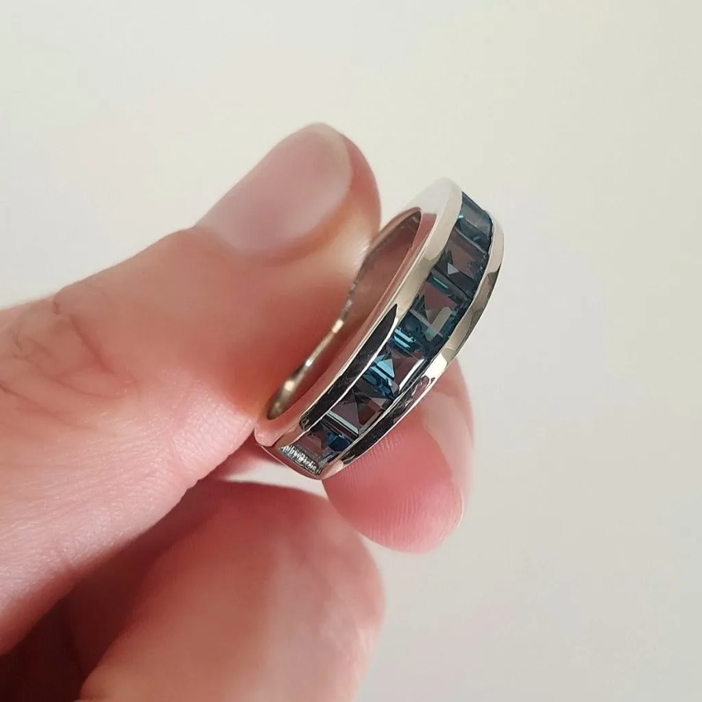 Contemporary Half Eternity Ring Featuring Seven Square Cut London Blue Topaz